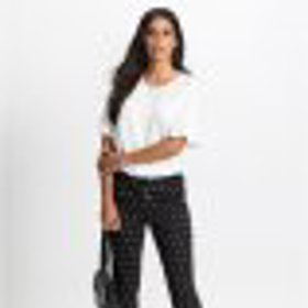 Puntíkaté kalhoty ozvláštní každý pracovní outfit.
