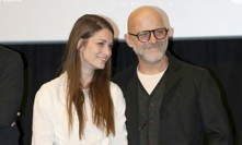 Hynek Čermák s expartnerkou Veronikou na premiéře filmu Neporazitelní.