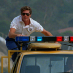 Někdo seriál považuje za kultovní, někdo zase za odpad. Každopádně s 1,1 miliardou diváků se stal, dle knihy rekordů, nejsledovanějším seriálem všech dob. Na snímku David Hasselhoff jako Mitch Buchannon.